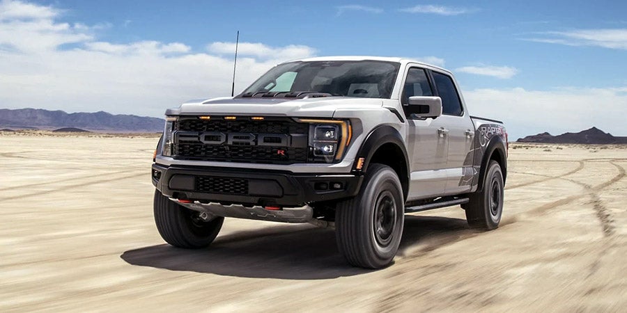 Ford F-150 Raptor driving outdoors