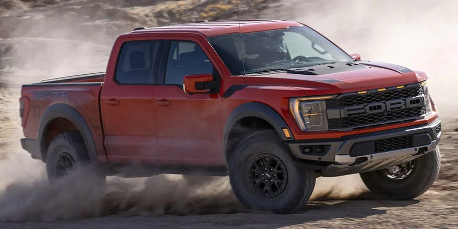 Ford F-150 Raptor driving outdoors